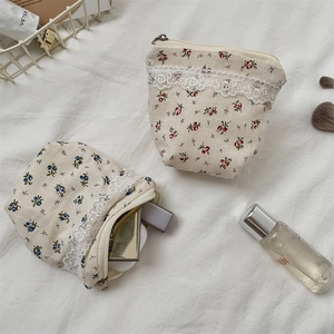 Floral cotton storage bag with lace trim, ideal for cosmetics and small accessories