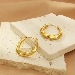 Luxury 18k gold plated stainless steel irregular twisted hoop earrings on stone