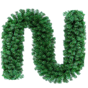 Close-up of flexible 9FT green PVC Christmas garland showing dense artificial pine needles