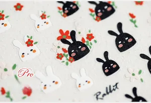 Macro detail of 5D ultra-thin nail stickers with cartoon rabbit and flower designs