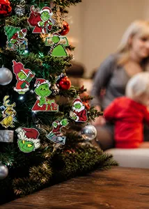Detail of Grinch themed Christmas tree card ornaments featuring festive character poses