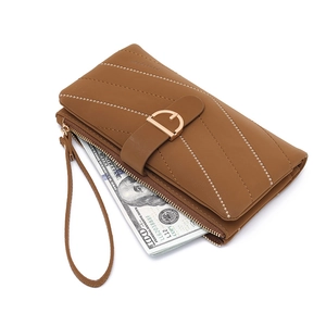 Brown faux leather long wallet for women with quilted texture and gold D-buckle strap
