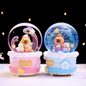 Luminous pink and blue Capybara crystal balls with liquid glitter on a festive background