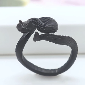 Macro detail of adjustable black fox ring featuring intricate matte hair textures