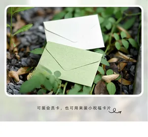 Macro shot of vintage fiber textured mini paper envelopes for gift cards in nature setup