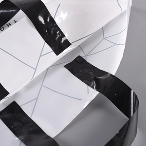 Elegant PE plastic shopping bag with white geometric patterns and secure black adhesive seal