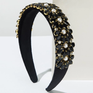 Detail of baroque headband with black crystals, white pearls, and gold metal finish