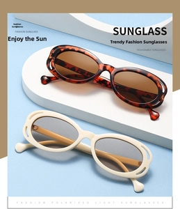 Detail of polarized sunglasses with hollow frames in tortoiseshell and cream finishes
