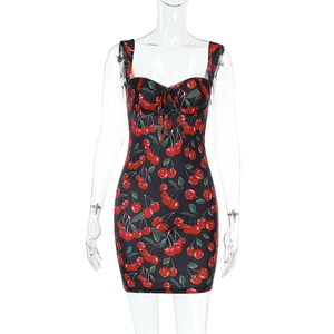 Detailed view of cherry print pattern and drawstring knot on black slim fit mini dress