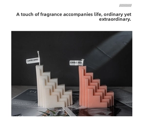 Detailed view of S-shaped staircase scented candles in elegant white and pink tones