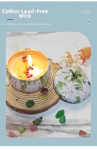 Detailed view of scented candle with cotton lead-free wick on rustic wood base
