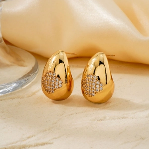 French vintage teardrop earrings in gold with pavé-set zircons on elegant fabric base