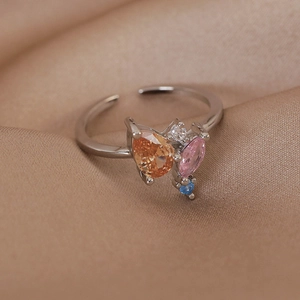 Macro detail of silver adjustable ring with colorful marquise and round cubic zirconia
