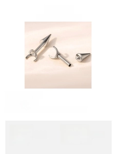 Macro detail of F136 titanium alloy piercing stud with 0.9mm thread and 4mm cone head