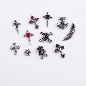 Silver Halloween nail charms featuring retro skulls, crosses and stars with rhinestones