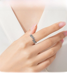 Macro detail of S925 silver olive leaf ring featuring elegant blue turquoise stones