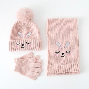 Detailed view of pink knitted girl winter set with cute bunny embroidery and sequins