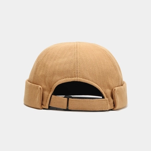 Detail of khaki herringbone docker hat showing adjustable strap and texture