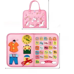 Pink unicorn felt busy board for toddlers showing clock, zipper and alphabet details