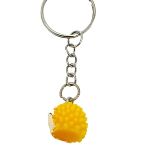 Creative yellow resin hedgehog keychain with silver ring and chain on white background