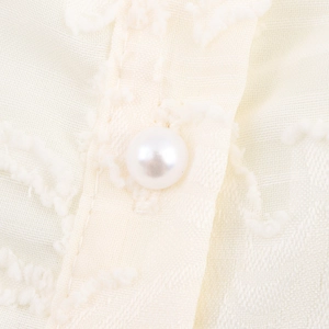 French style ruffle blouse in cream white featuring pearl button and jacquard fabric details