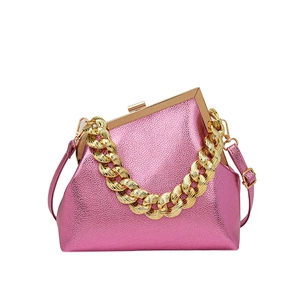 Metallic pink leather crossbody bag with gold chain handle and framed top closure
