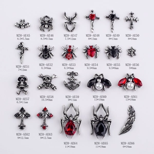 Gothic Halloween nail art charms with vintage silver spiders and crosses in a grid layout