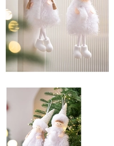Detailed view of white plush Christmas angel ornaments hanging on a festive Xmas tree