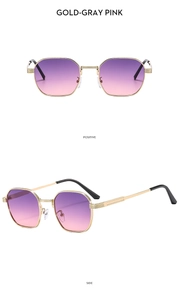 Detail of gold metal hexagonal sunglasses featuring gradient purple to pink lenses