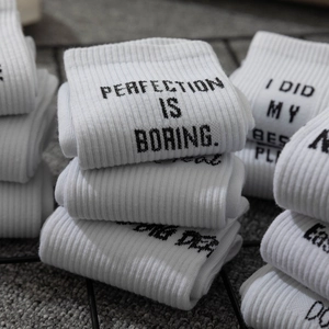 White ribbed mid-calf socks with black Perfection is Boring slogan print for streetwear