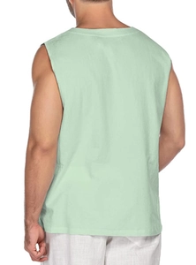 Rear view of mint green men's sleeveless cotton linen shirt showing texture and fit