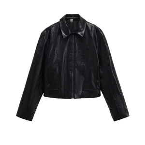 Detail view of black faux leather jacket texture with lapel collar and metal zipper