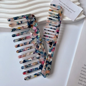 Colorful acetate comb set featuring wide-tooth and handle hair combs in shell pattern