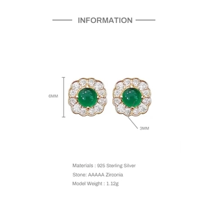 Detail view of 6mm flower stud earrings in 925 sterling silver with green zirconia