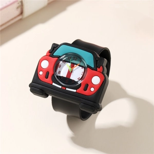 Close-up of red cartoon car kids watch with black rubber strap and easy-to-read dial