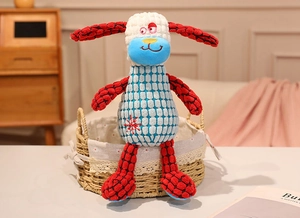 Close-up of plush animal toy with pineapple grid fabric and snowflake embroidery detail