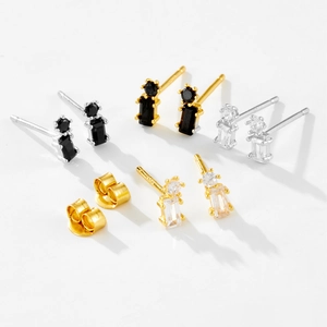 Macro detail of S925 sterling silver stud earring sets with white and black zircons