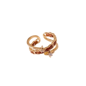 Vintage gold layered open ring with brown leather twist and sparkling star charms