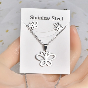 Stainless steel butterfly jewelry set with necklace and earrings on a white display card