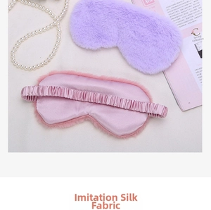 Detail of soft imitation silk fabric and elastic strap on a plush sleeping eye mask