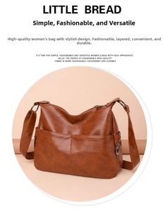 Detailed view of brown PU leather shoulder bag with lychee texture and multi-zipper pockets