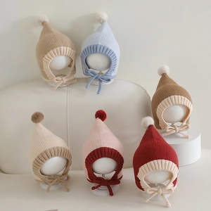 Knitted baby pixie hats with pom-poms and chin straps in six assorted winter colors