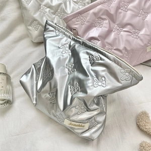 Quilted PU leather cosmetic pouches with embossed butterfly patterns in silver, pink and white