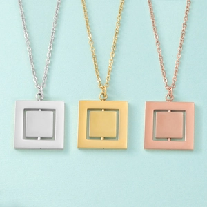 Detailed view of rotating double-layer square pendants in silver, gold, and rose gold finishes