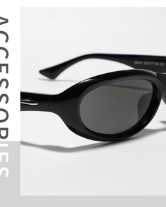 Macro shot of silver metal hinges and specifications on Y2K black oval sunglasses