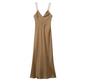 Close-up detail of champagne satin long slip dress showing smooth glossy fabric texture