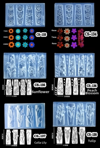 Macro detail of 3D floral silicone nail molds featuring tulip and peach blossom designs