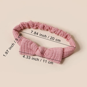 Pink elastic cotton baby headband with bow, showing size measurements of 20x5 cm
