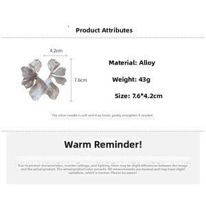 Detailed size chart for vintage silver flower earrings with matte metal texture