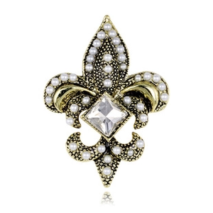 Detail of vintage fleur-de-lis brooch with gold alloy, white pearls and square crystal